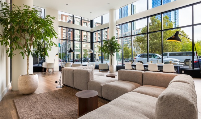 Take advantage of all One Grove has to offer a room with large windows and a couch and chairs