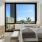 a bedroom with a large window