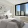 a bedroom with a large window