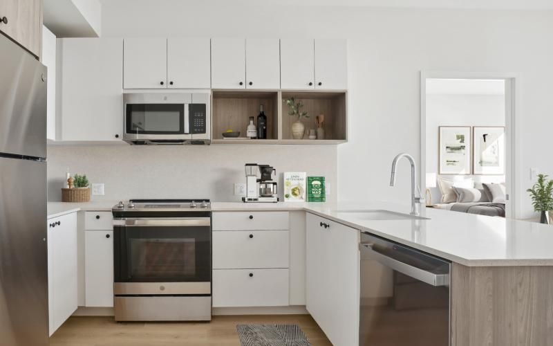 a kitchen with white cabinets