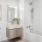 a bathroom with a tub toilet and sink